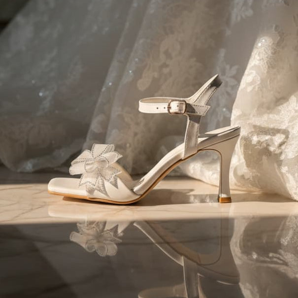 White wedding shoe with decorative flowers